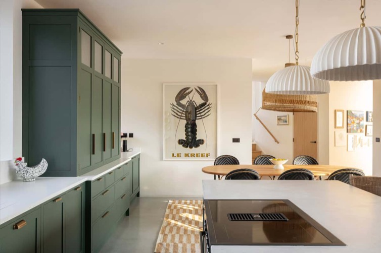 Hazelbridge Cottage bespoke green kitchen with dining area and statement pendant lights